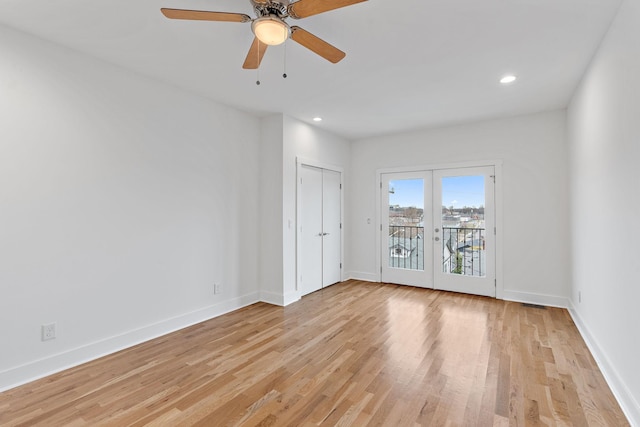 unfurnished room featuring recessed lighting, light wood-style floors, baseboards, and french doors