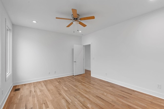 unfurnished room featuring light wood finished floors, visible vents, baseboards, recessed lighting, and a ceiling fan