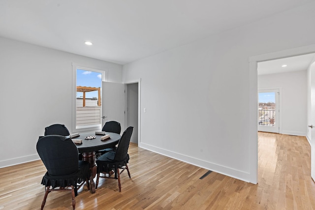 dining room featuring recessed lighting, baseboards, and light wood-type flooring