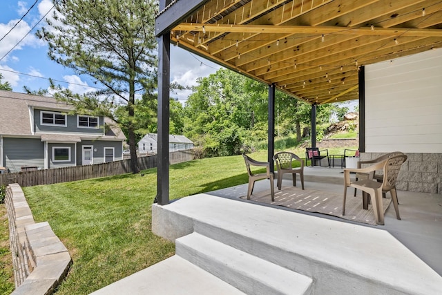 view of patio featuring fence