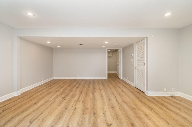 spare room with light wood-style flooring, recessed lighting, and baseboards