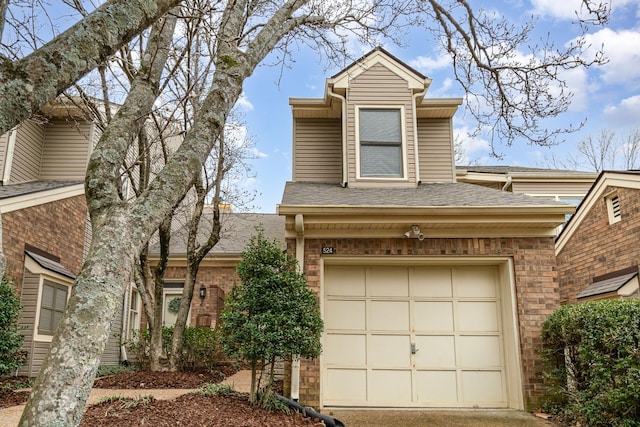 view of front of house featuring brick siding, a shingled roof, and a garage