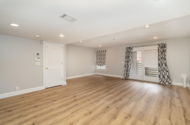 unfurnished room featuring recessed lighting, baseboards, visible vents, and light wood finished floors