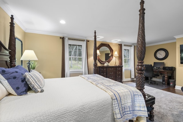 bedroom with crown molding, recessed lighting, wood finished floors, and baseboards