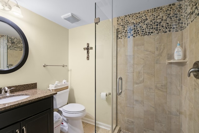 full bathroom featuring tile patterned floors, a stall shower, toilet, and vanity