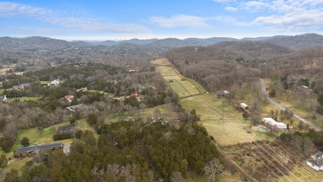 bird's eye view with a wooded view and a mountain view