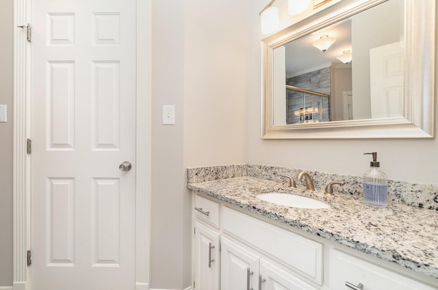 bathroom with vanity and a shower