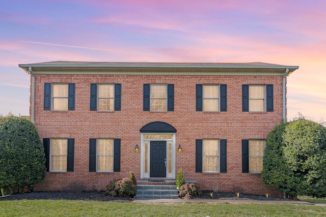 view of front facade featuring brick siding