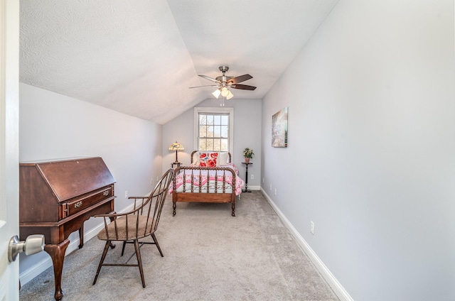 bedroom with carpet flooring, a ceiling fan, lofted ceiling, and baseboards