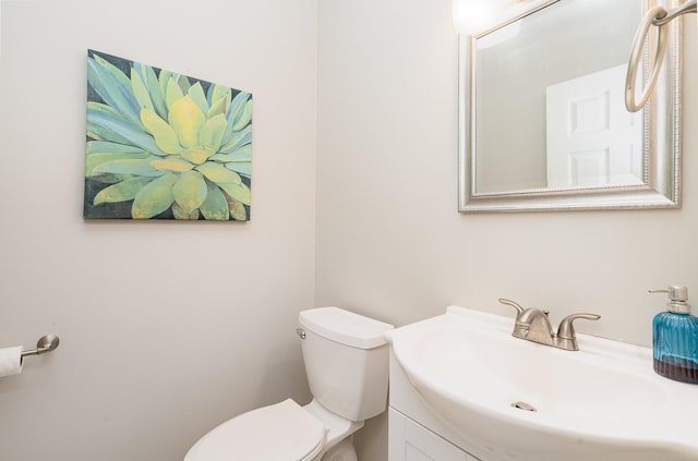 bathroom with toilet and vanity