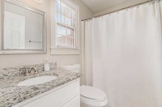 full bath featuring toilet and vanity