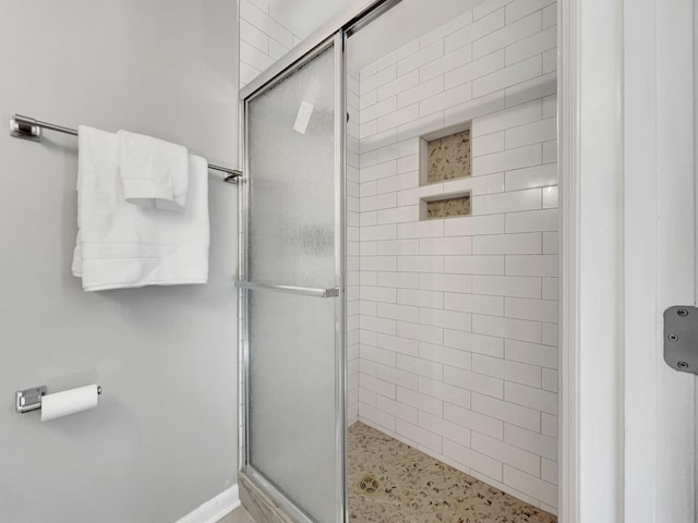 full bathroom with a shower stall