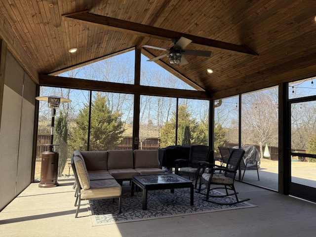 sunroom / solarium featuring ceiling fan, wooden ceiling, and vaulted ceiling