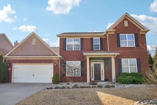 traditional home with concrete driveway, brick siding, and a garage