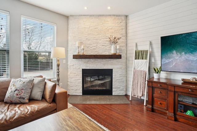 living room with wood finished floors and a fireplace