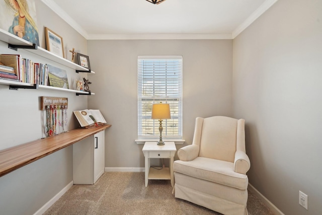 sitting room with baseboards, light carpet, and ornamental molding