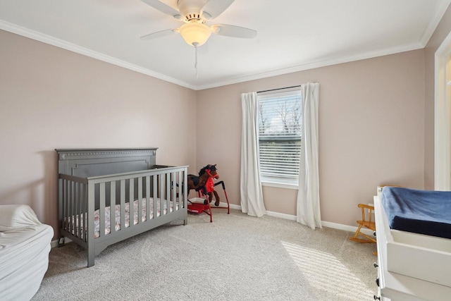 bedroom with carpet flooring, baseboards, ceiling fan, and crown molding