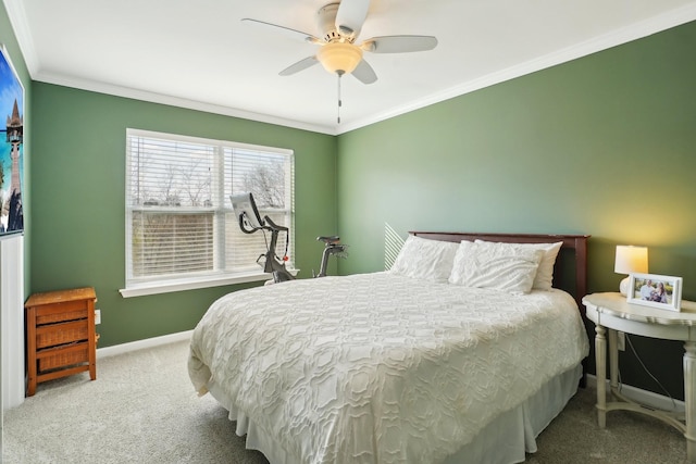 carpeted bedroom featuring ceiling fan, crown molding, and baseboards