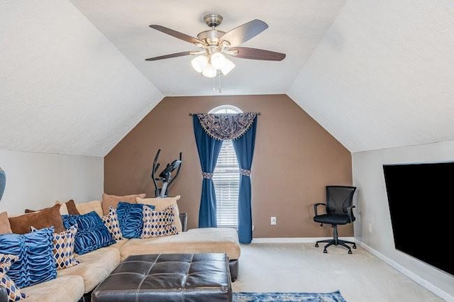 interior space with baseboards, lofted ceiling, ceiling fan, and carpet flooring