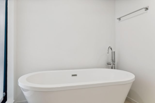 bathroom with a freestanding tub