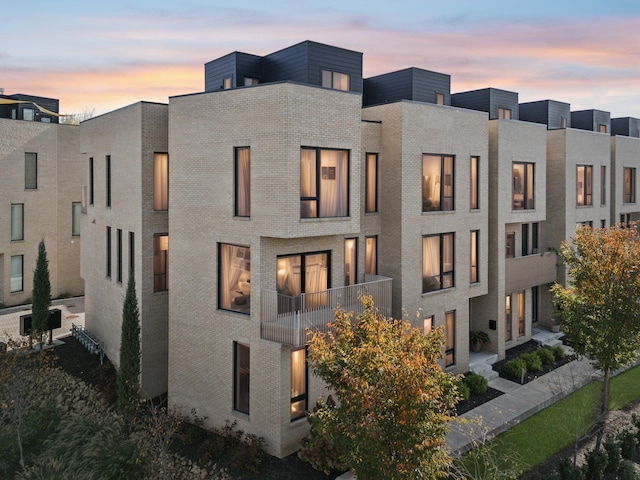 exterior space featuring brick siding