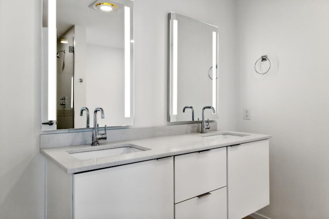 bathroom with double vanity and a sink