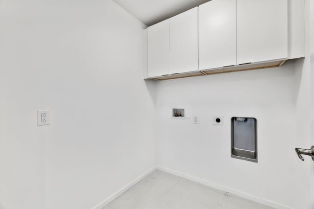 laundry area with electric dryer hookup, baseboards, cabinet space, and washer hookup