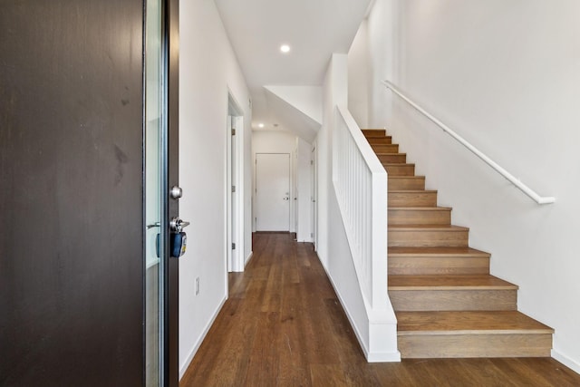 entrance foyer with recessed lighting, baseboards, wood finished floors, and stairs