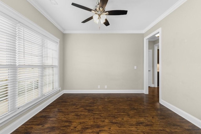 spare room with ornamental molding, ceiling fan, baseboards, and wood finished floors