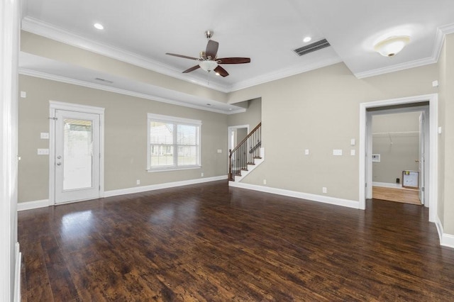 unfurnished living room featuring stairway, dark wood-style floors, and ornamental molding