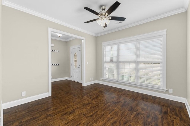 spare room with ornamental molding, ceiling fan, baseboards, and wood finished floors