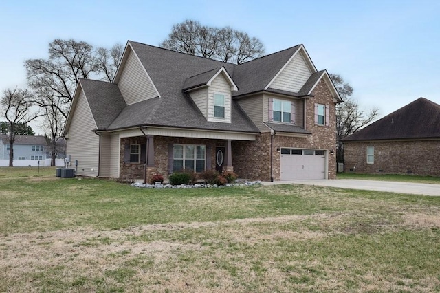 view of front of property with brick siding, central air condition unit, a front yard, driveway, and an attached garage