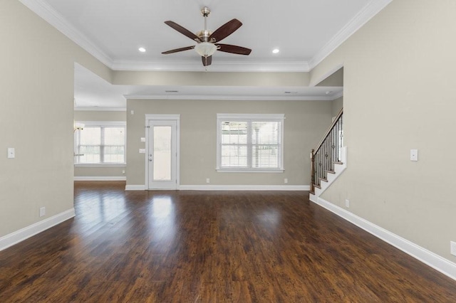 unfurnished living room with stairway, ornamental molding, baseboards, and dark wood-style flooring