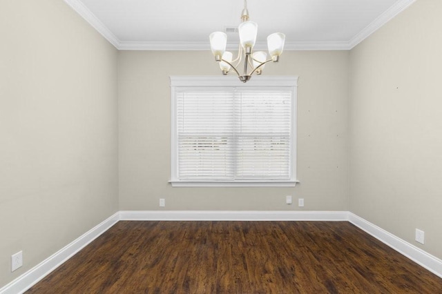 spare room featuring a notable chandelier, wood finished floors, and baseboards