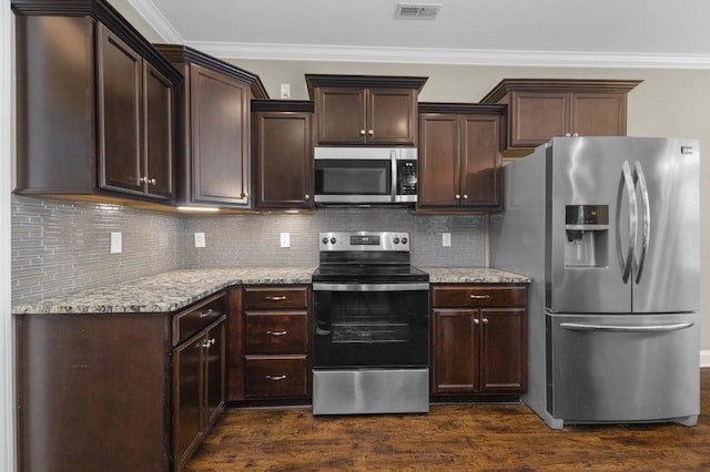 kitchen featuring visible vents, dark wood finished floors, ornamental molding, stainless steel appliances, and dark brown cabinets