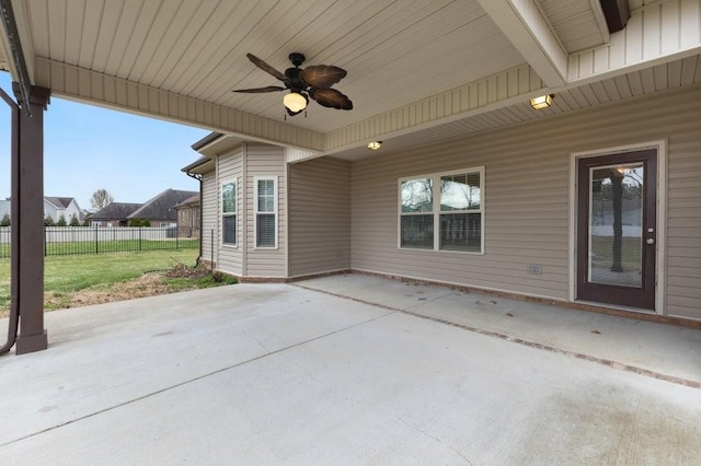 view of patio / terrace with a ceiling fan and fence