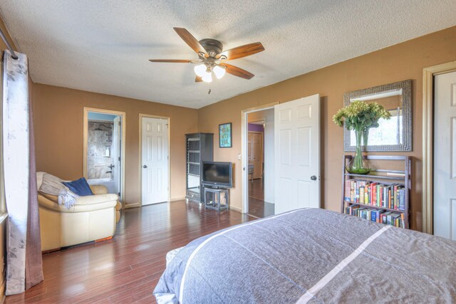 bedroom featuring ceiling fan, a textured ceiling, and wood finished floors