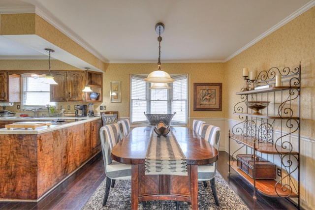 dining room featuring wallpapered walls, dark wood-type flooring, and crown molding