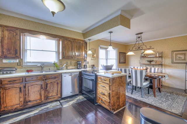 kitchen with wallpapered walls, dishwasher, wainscoting, black / electric stove, and a sink