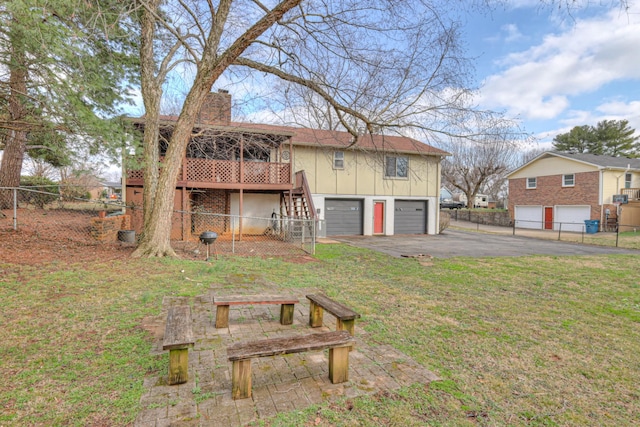 exterior space featuring board and batten siding, fence, stairs, a chimney, and an attached garage