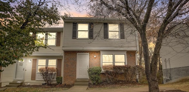 view of front of property featuring brick siding and entry steps