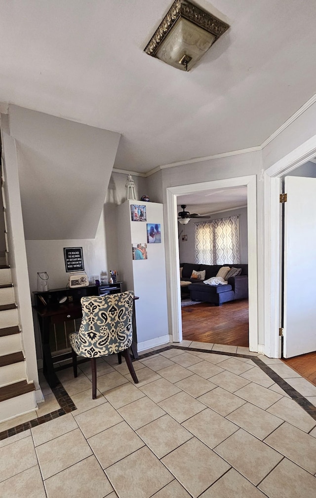 interior space featuring crown molding, stairway, and light tile patterned flooring