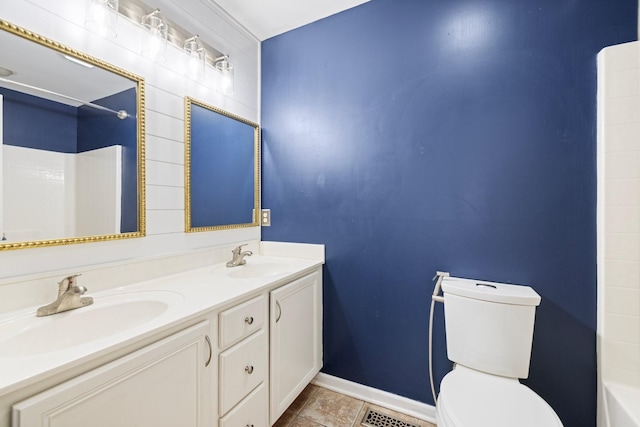 bathroom with tile patterned flooring, toilet, visible vents, and a sink