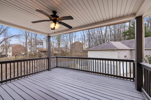 wooden terrace featuring a ceiling fan