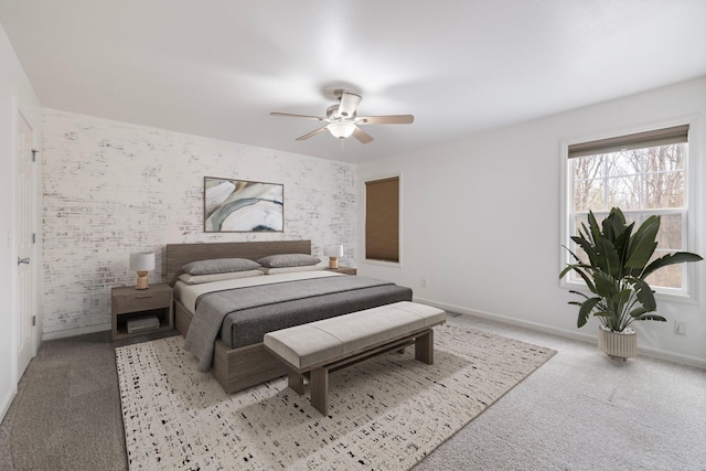 bedroom featuring wallpapered walls, a ceiling fan, baseboards, and carpet floors