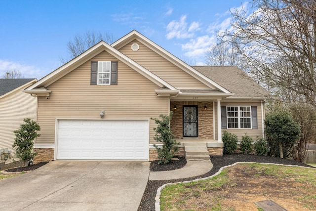 view of front of house with concrete driveway, an attached garage, stone siding, and a shingled roof