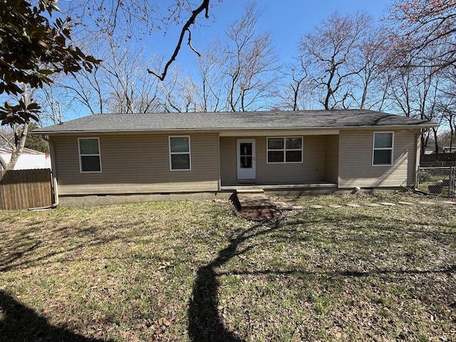 ranch-style house featuring crawl space, a front lawn, and fence