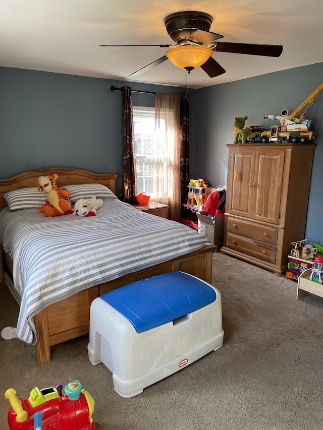 bedroom with carpet and a ceiling fan