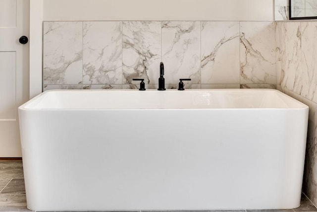 full bath featuring a soaking tub