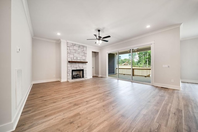 unfurnished living room featuring a fireplace, light wood-style flooring, a ceiling fan, and baseboards